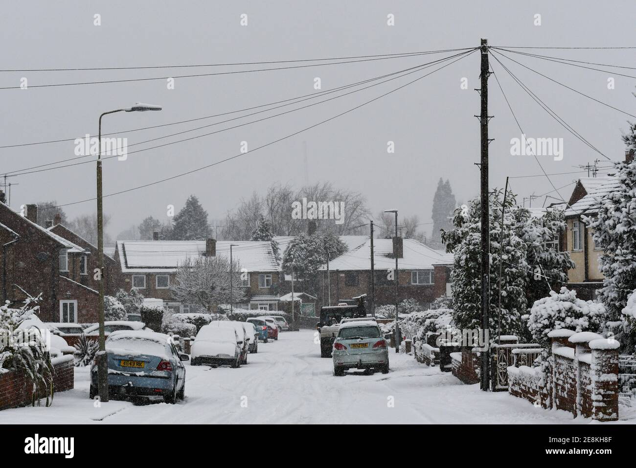 cars on a street covered in snow Stock Photo - Alamy