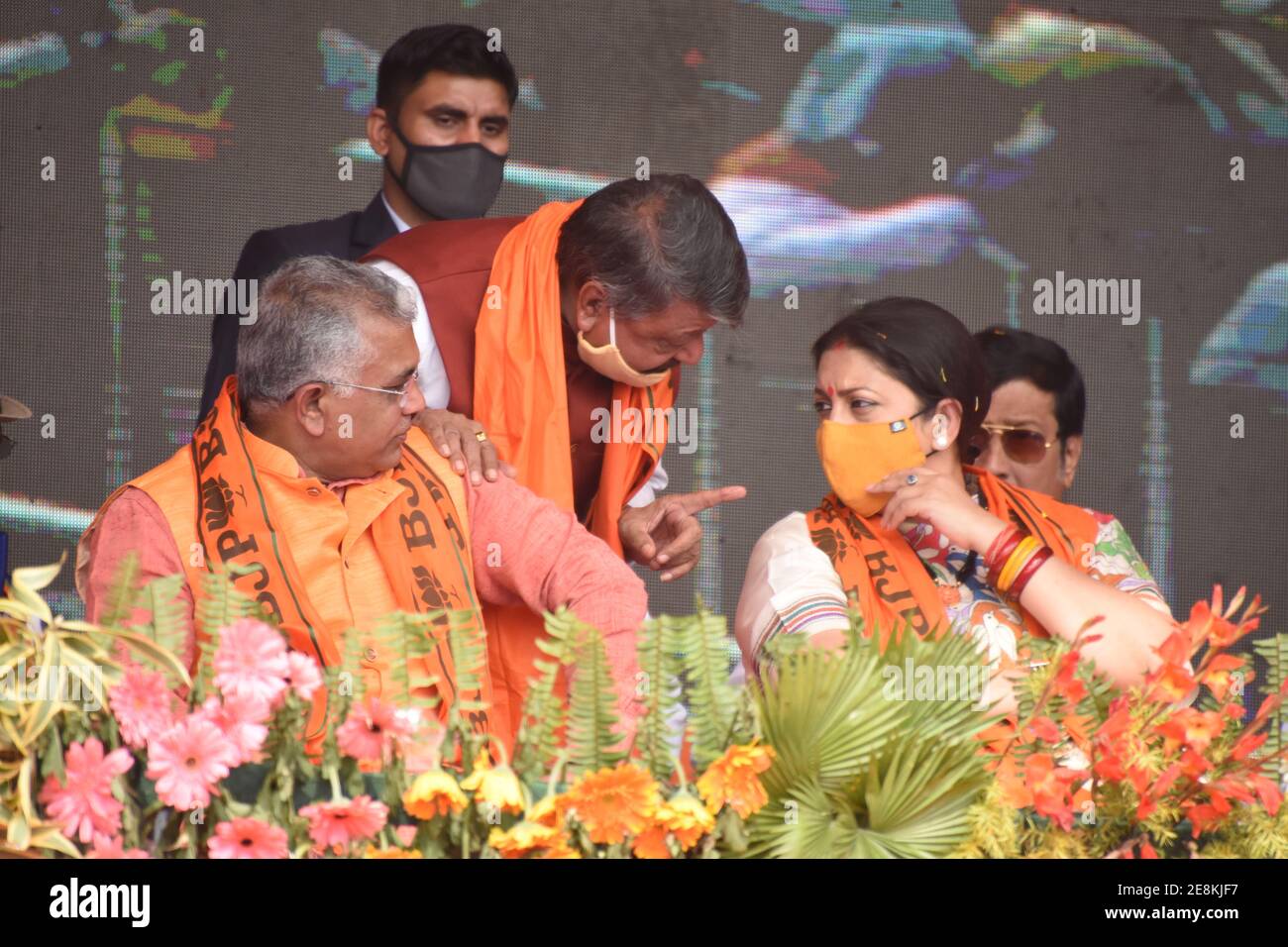 Howrah, India. 31st Jan, 2021. BJP leader Kailash Vijayvargiya (M) talks  with Union Cabinet Minister Smriti Zubin Irani (R) in the prsents of Member  of Perlament Dilip Ghosh (L) at a public