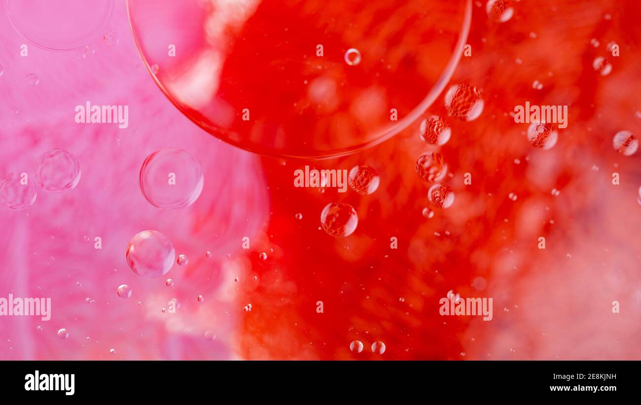 Oil drops on a water surface. Abstract and background. Stock Photo