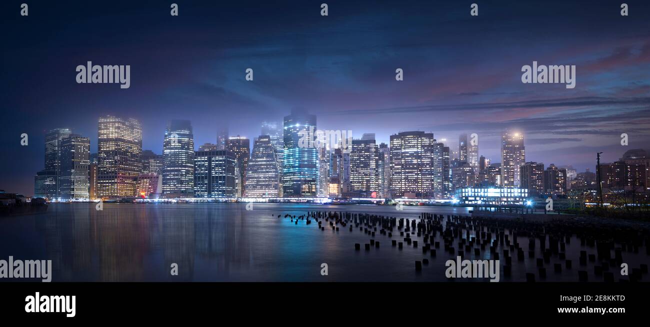 The New York City skyline at night photographed from across the East ...