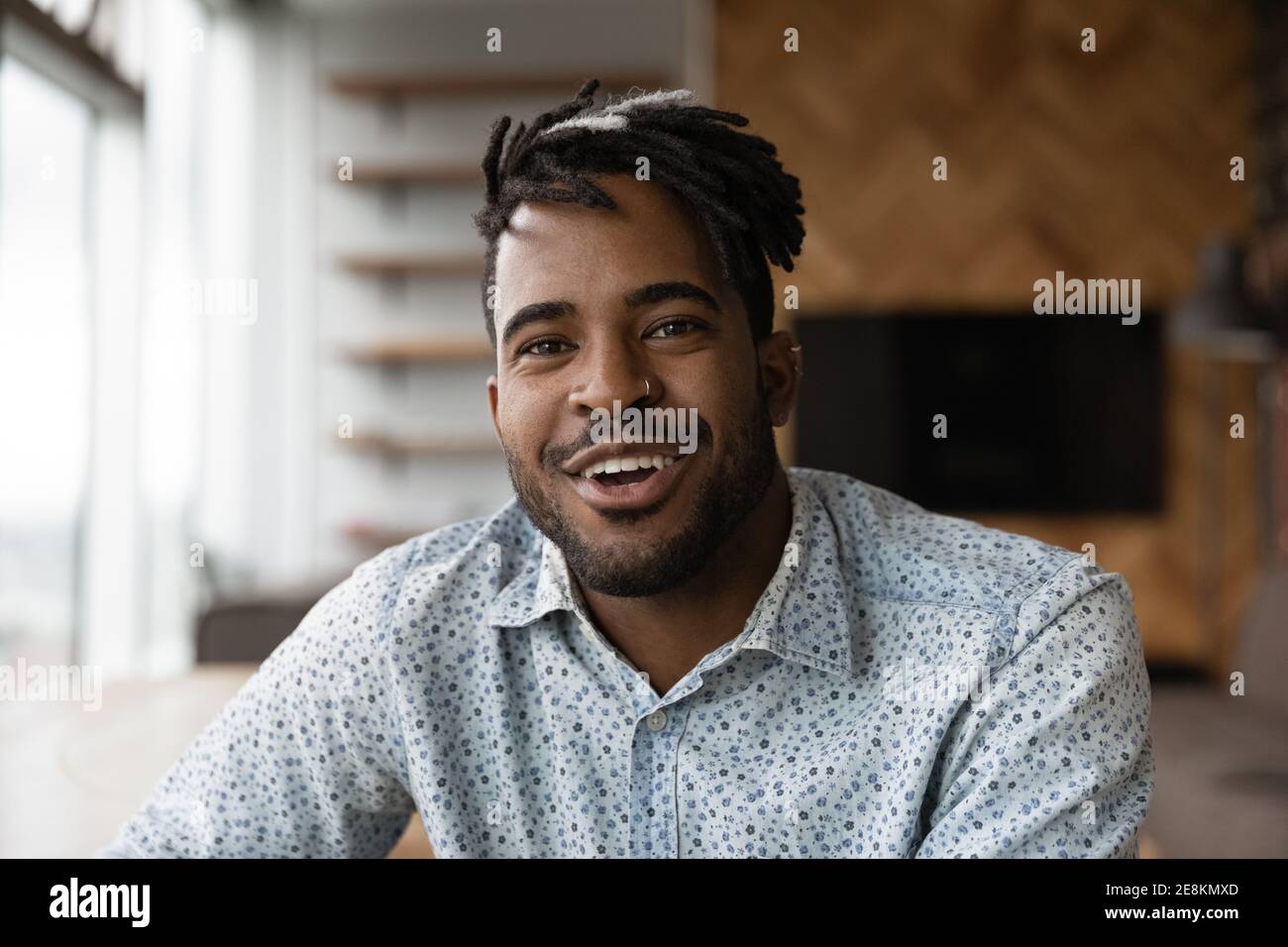 Friendly african male vlogger shooting clip content for personal channel Stock Photo