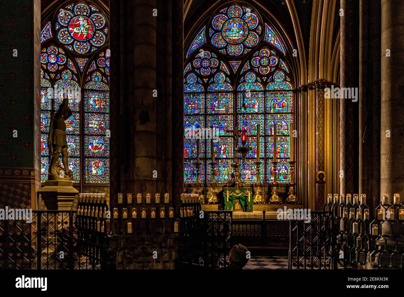 Stained glass windows and the Altar of Saint-Georges chapel,a side chapelinsid Notre-Dame de Paris Cathedral ,Paris,France Stock Photo