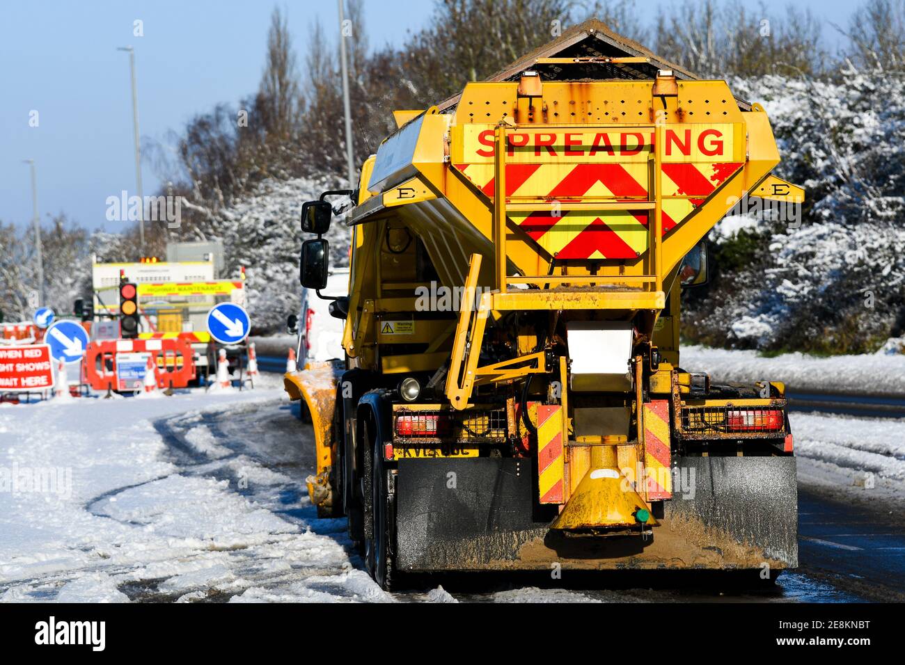 snowplough and gritter driving on the a6 loughborough Stock Photo