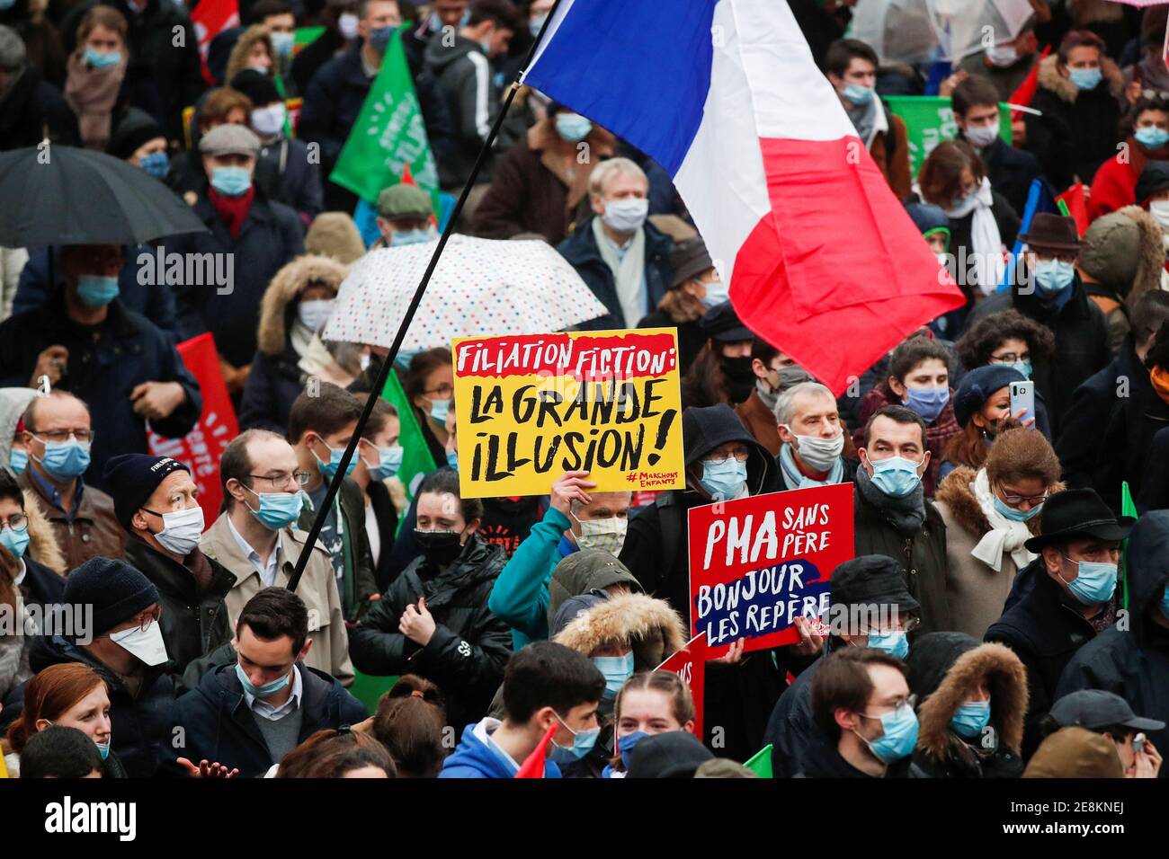 A person holds a placard reading ''Fictional filiation: The great illusion!'' during a protest against medically assisted procreation PMA, surrogate motherhood GPA and the bioethics bill in front of the Health Ministry in Paris, France, January 31, 2021. REUTERS/Benoit Tessier Stock Photo
