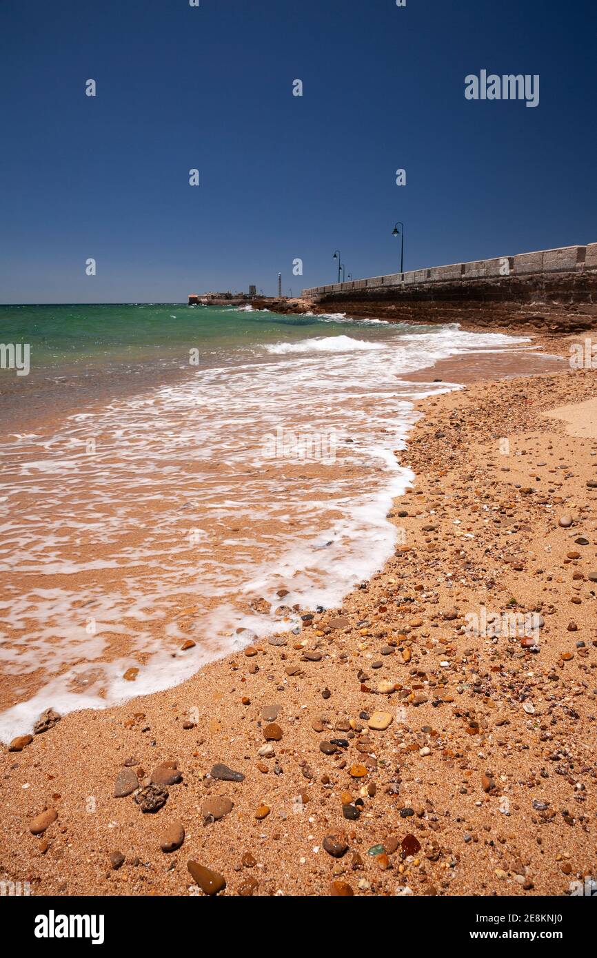 Breakwater and promenade on the beach, Cadiz, Spain Stock Photo