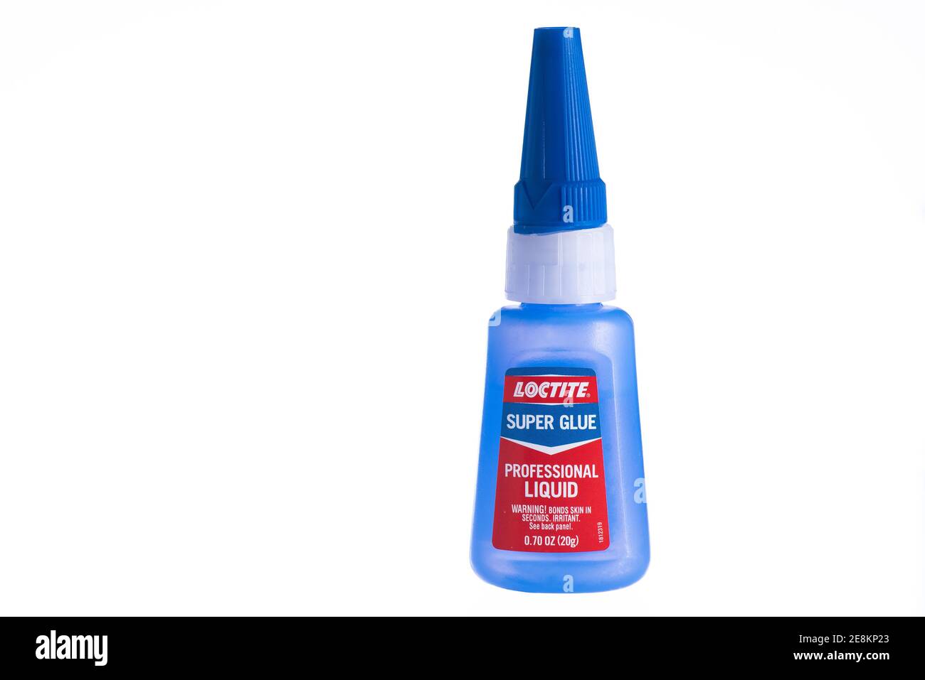 Boise, Idaho, January, 22, 2021. A small blue container of loctite super glue on an isolated white background. Stock Photo