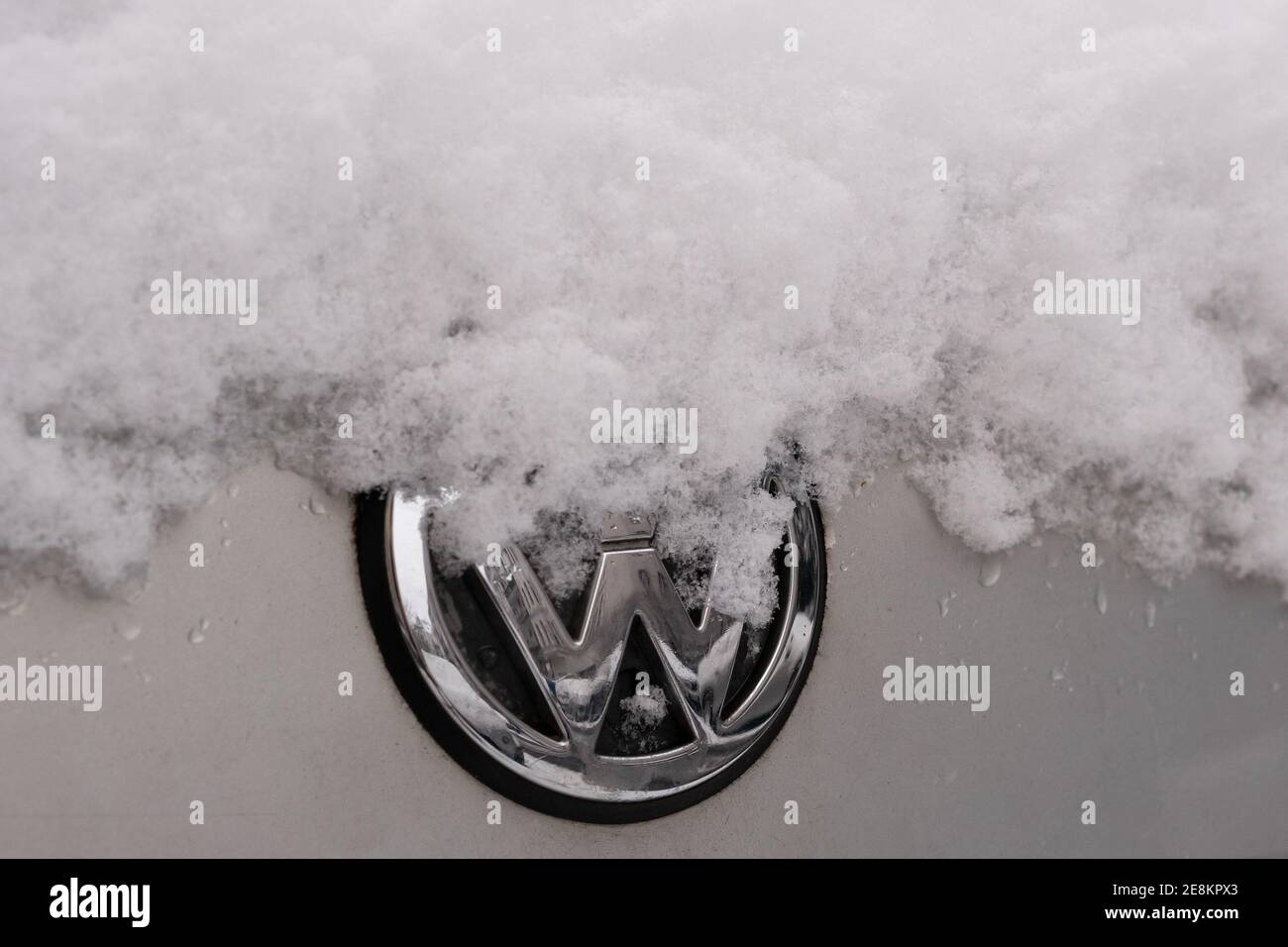 BERLIN, GERMANY - JANUARY 30, 2021: Close-up of A Snow-capped VW Logo On A Car In Berlin, Germany Stock Photo