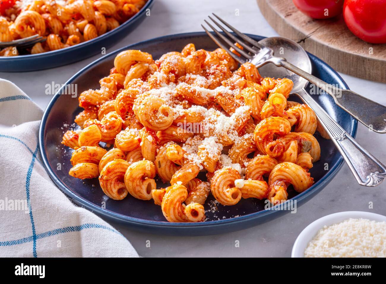Delicious cavatappi pasta with tomato sauce and parmesan cheese. Stock Photo