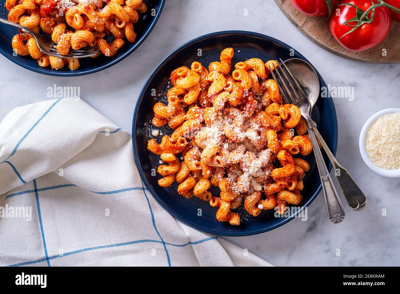 Delicious cavatappi pasta with tomato sauce and parmesan cheese. Stock Photo