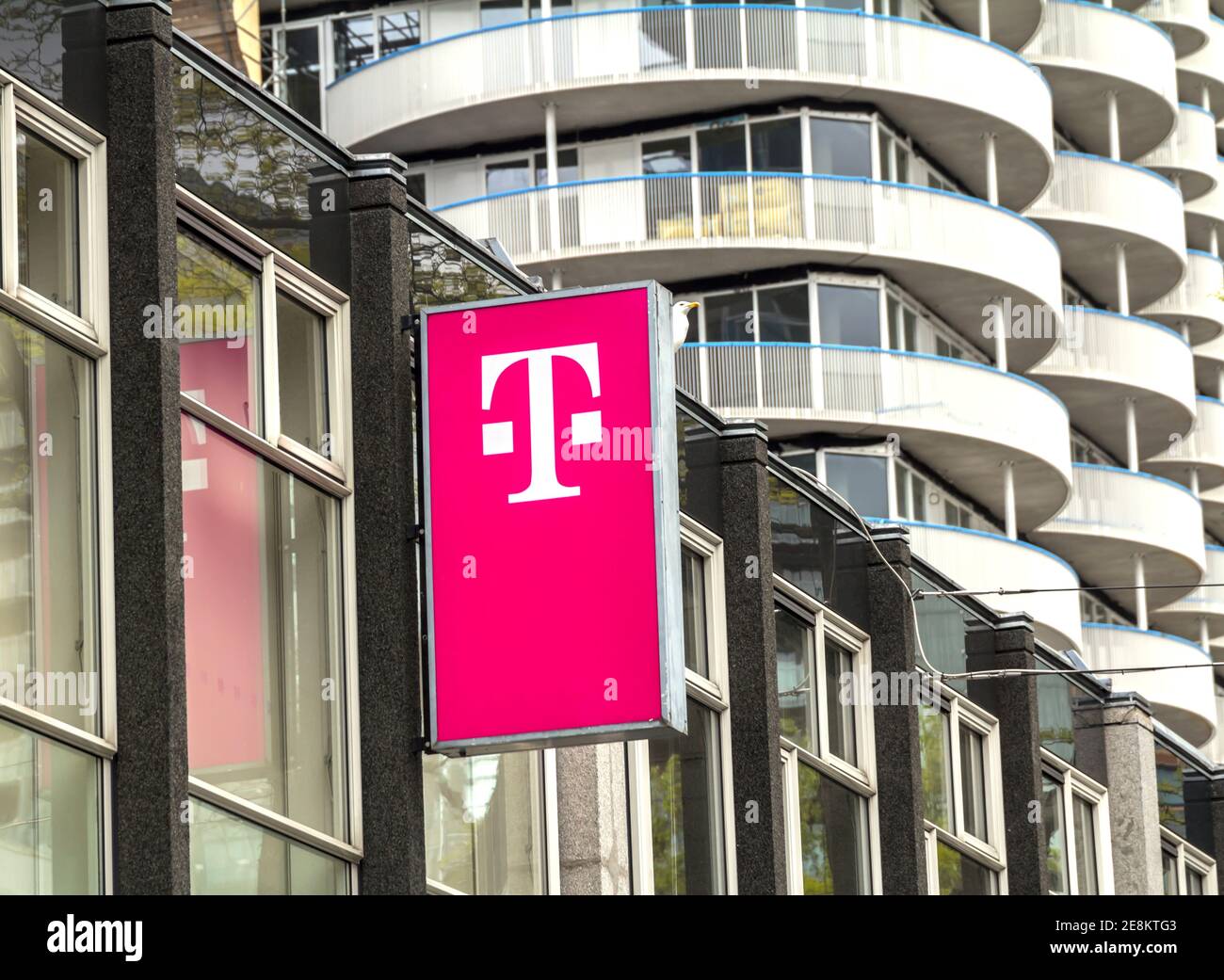 T-Mobile logo on a store. T-Mobile is the brand name used by the mobile communications subsidiaries of the German telecommunications company Stock Photo