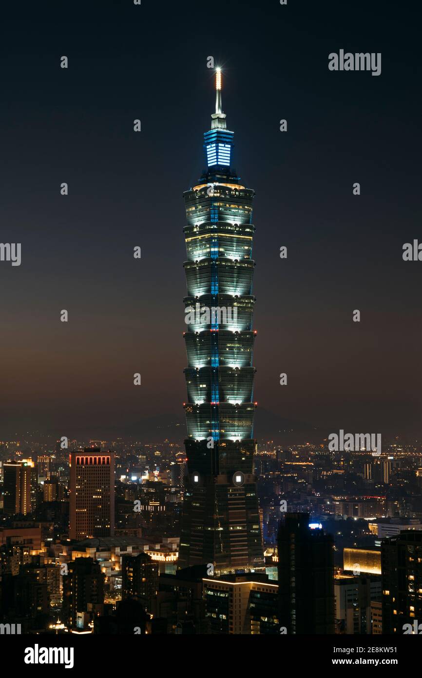 portrait view of Taipei 101 tower and cityscape at night with city