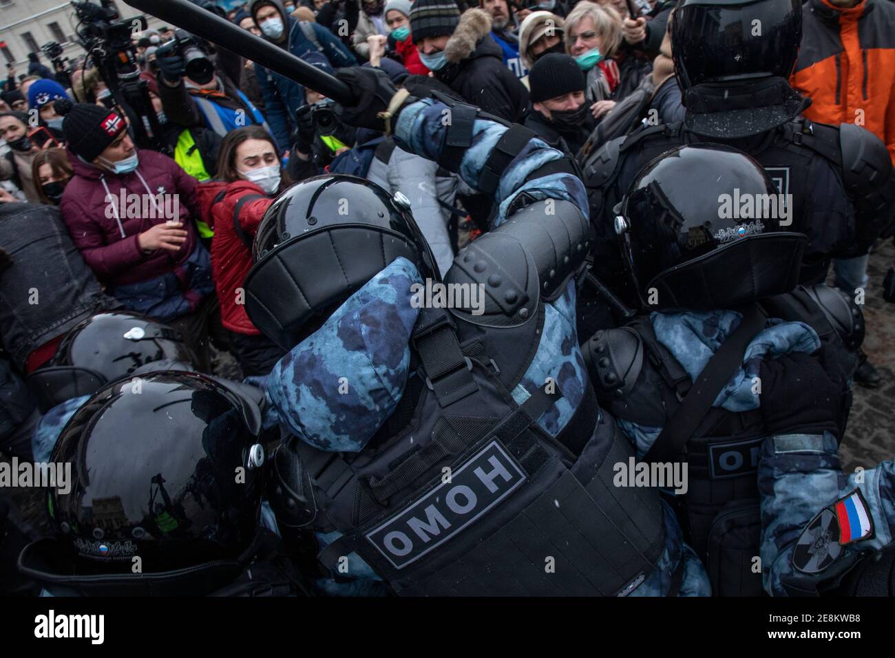 Moscow, Russia. 31st of January, 2021 Protesters oppose riot police during a rally in support of jailed opposition leader Alexei Navalny on Komsomolskaya square in Moscow, Russia. Kremlin critic Alexei Navalny was detained on January 17 upon returning to the country from Germany, where he was recovering from poisoning Stock Photo
