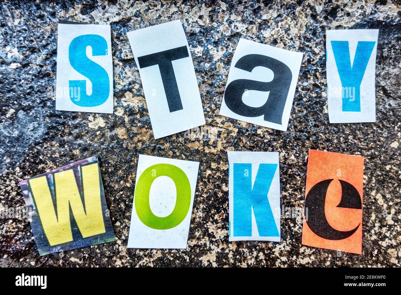 TheTerm 'Stay WOKE' using cut-out paper letters in the ransom note effect typography Stock Photo