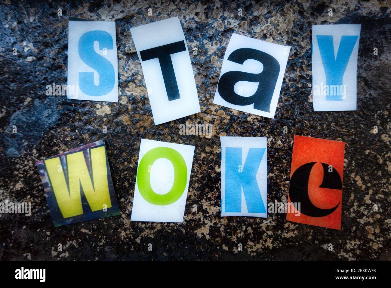 TheTerm 'Stay WOKE' using cut-out paper letters in the ransom note effect typography Stock Photo