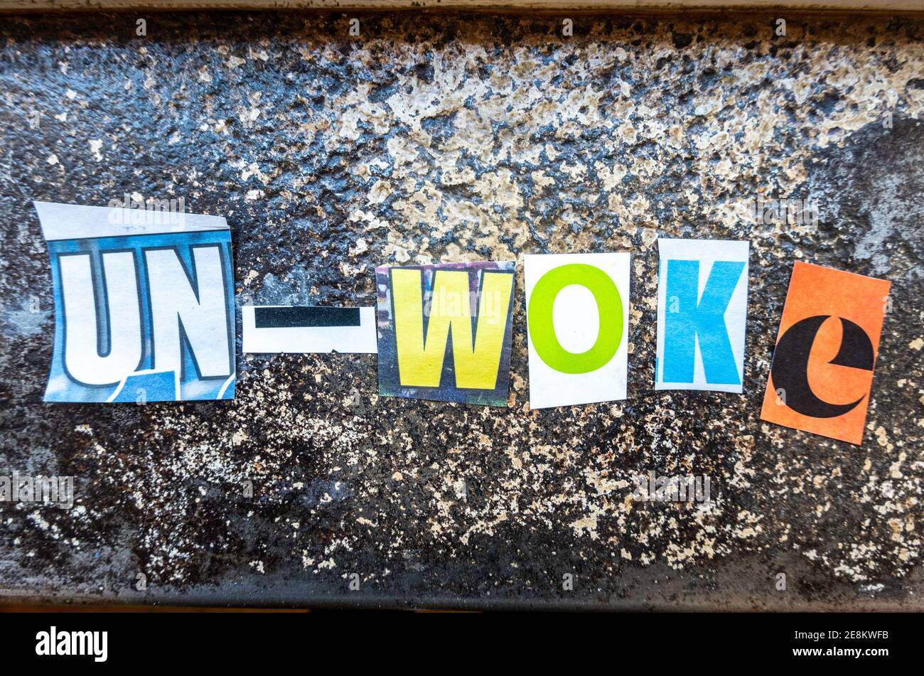 The Un- 'Woke'  using cut-out paper letters in the ransom note effect typography Stock Photo