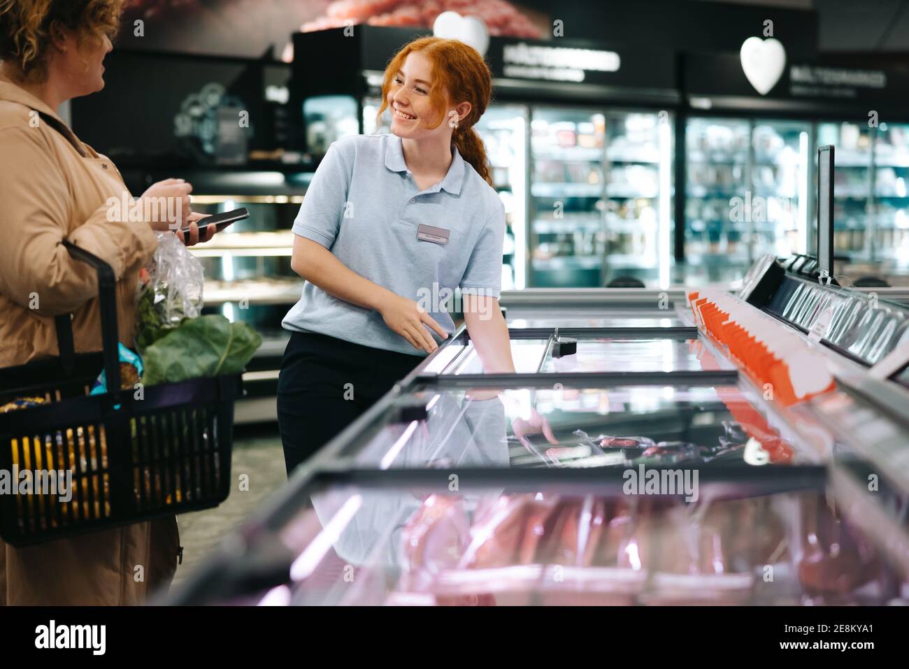 A shopper chooses a bag of Brach's Halloween candy corn in a