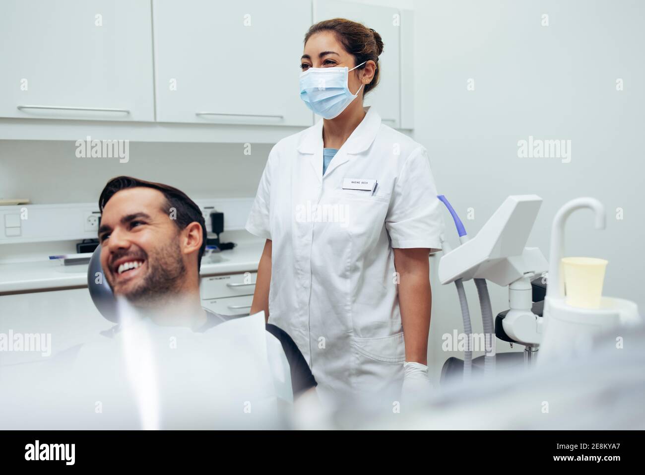 Female dentist wearing face mask hires stock photography and images