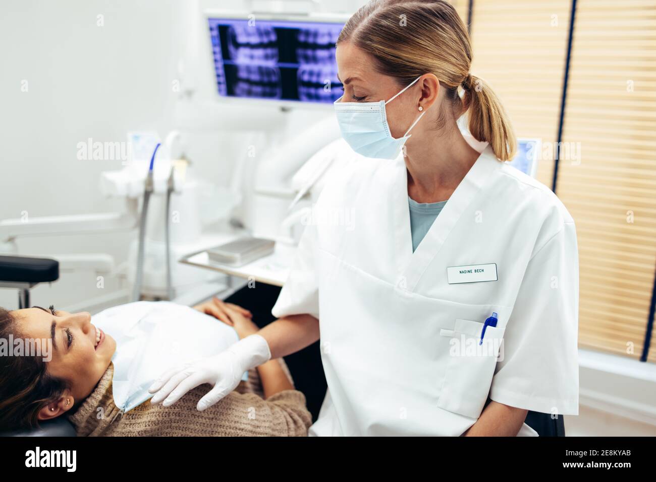 Female Dentist Wearing Face Mask High Resolution Stock Photography and