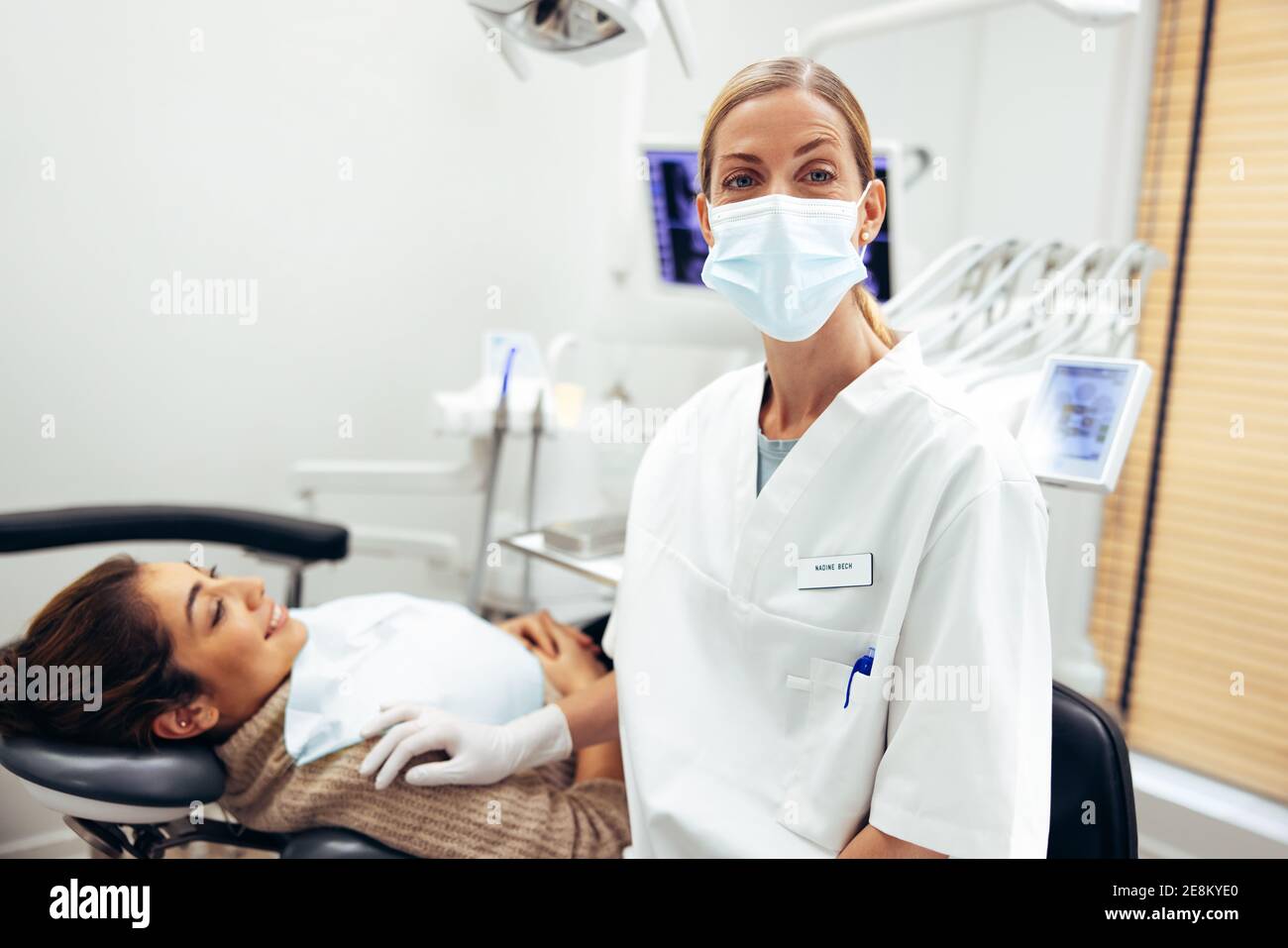 Female Dentist Wearing Face Mask High Resolution Stock Photography and