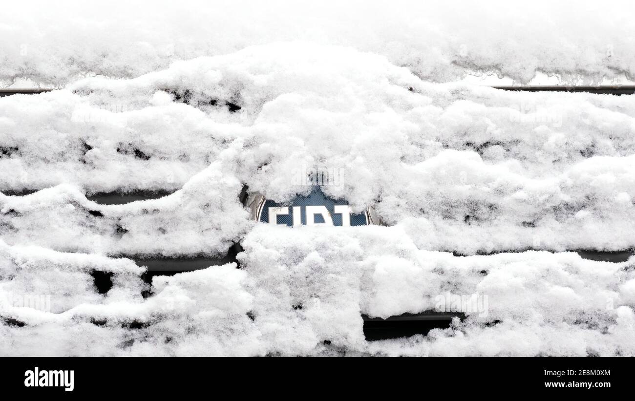 BERLIN, GERMANY - JANUARY 30, 2021: Close-up of A Snow-capped Fiat Logo On A Car In Berlin, Germany Stock Photo