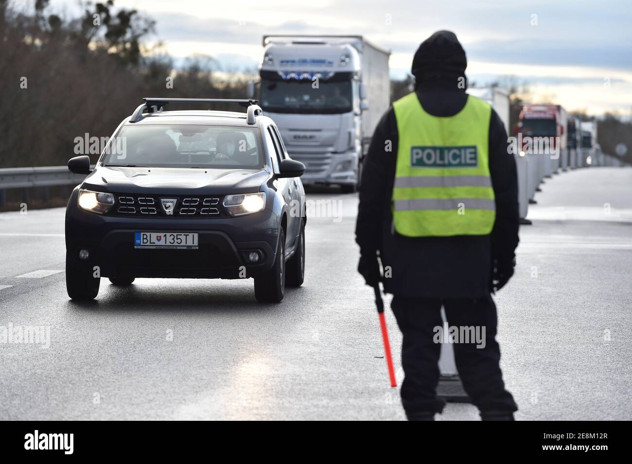 Lanzhot, Czech Republic. 30th Jan, 2021. Czech police officer inspects  traffic at the Breclav-Brodske border crossing at the Czech-Slovak border  in Lanzhot, Czech Republic, on January 30, 2021. Foreigners will not be