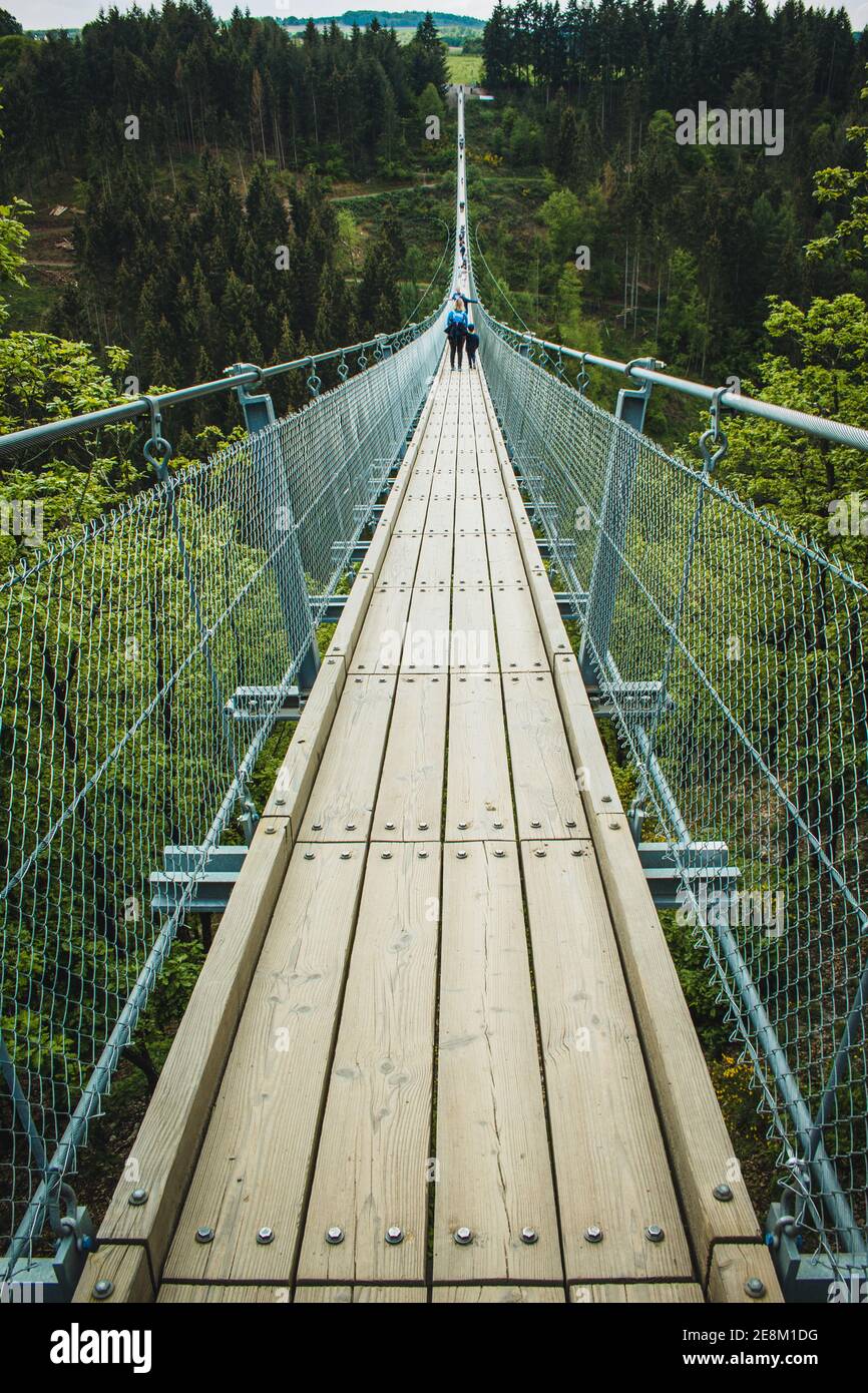 Geierlay Suspension Bridge in Hunsrück Mountain Range. It is the second longest suspension bridge in Germany and a famous tourist attraction. Stock Photo