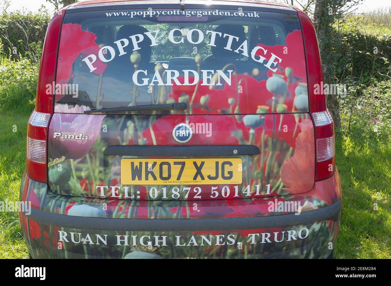 Colourful car used by previous owners of Poppy Cottage to promote garden open to visitors. New owners only operate garden workshops on the premises Stock Photo