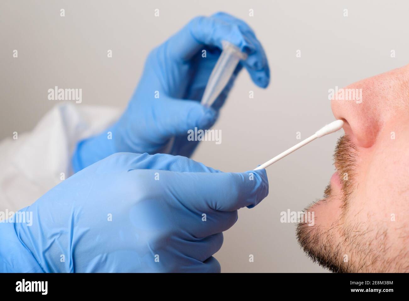 Coronavirus test. Medical worker or nurse taking a nasal swab for coronavirus sample from patient Stock Photo
