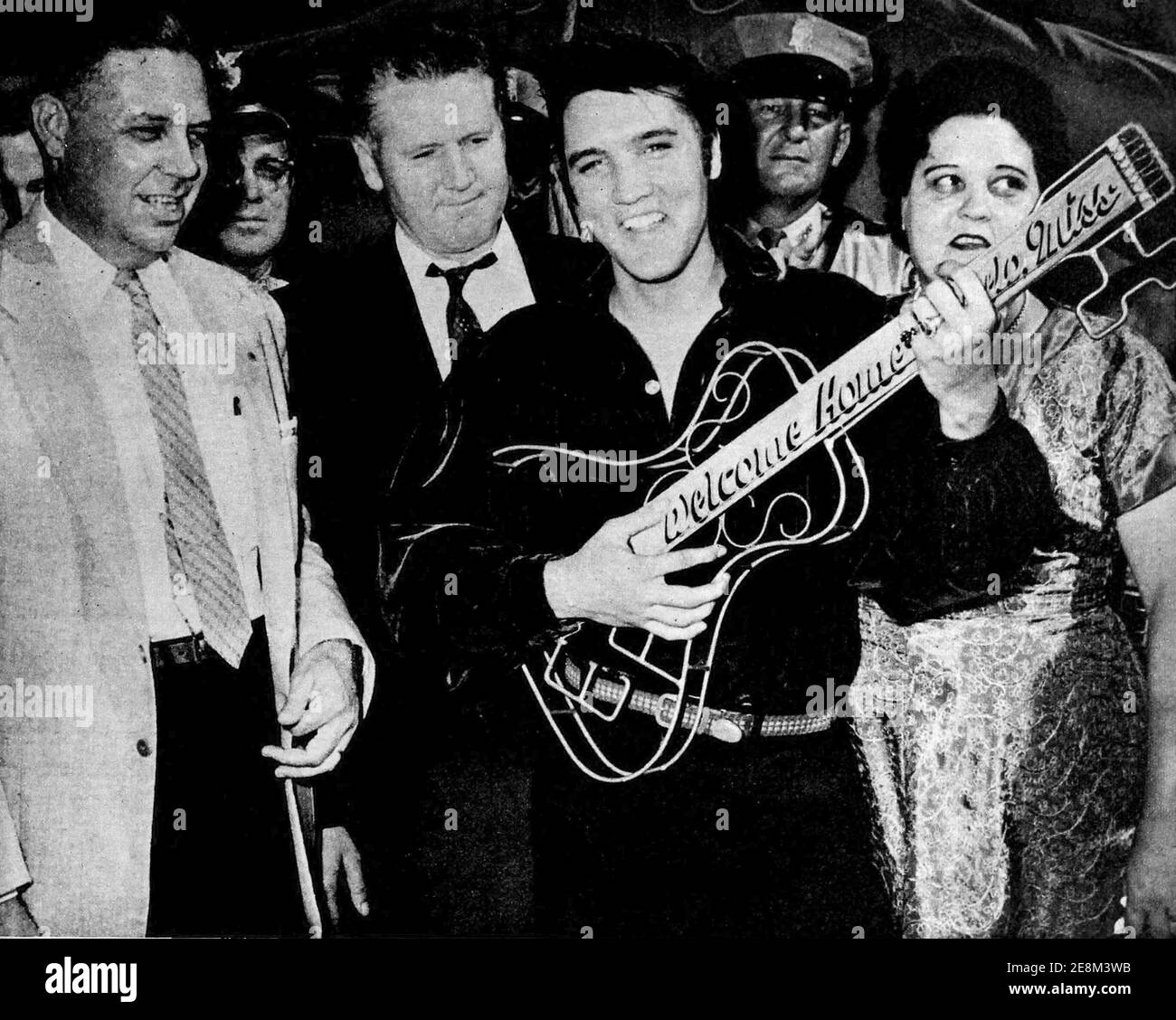 Elvis Presley was given a guitar-shaped key to the city by Mayor James L. Ballard when he returned to Tupelo, Mississippi. Stock Photo