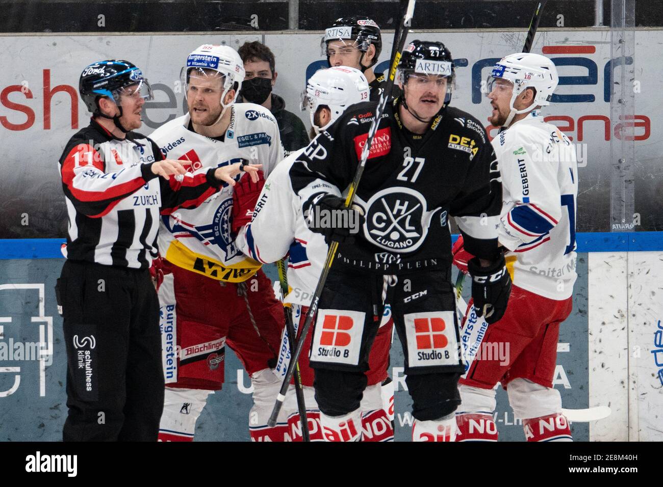 Porza, Corner Arena, National League: HC Lugano - SC, USA. 01st Mar, 2021. Rapperswil-Jona Lakers, referee Joris Mueller (11) decided for the video review. From left to right # 55 Daniel Vukovic (Lakers), # 13 Mauro Dufner (Lakers), # 14 Timo Haussener (Lugano), # 27 Alessandro Chiesa (Lugano) and # 18 Jeremy Wick (Lakers) Credit: SPP Sport Press Photo. /Alamy Live News Stock Photo