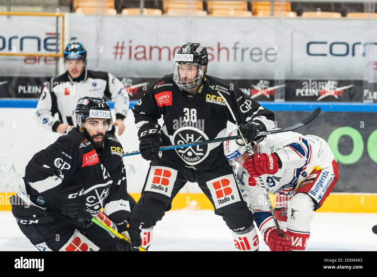 Porza, Corner Arena, National League: HC Lugano - SC, USA. 31st Jan, 2021. Rapperswil-Jona Lakers, # 23 Giovanni Morini (Lugano), # 38 Raffaele Sannitz (Lugano) and # 23 Nico Duenner (Lakers) Credit: SPP Sport Press Photo. /Alamy Live News Stock Photo