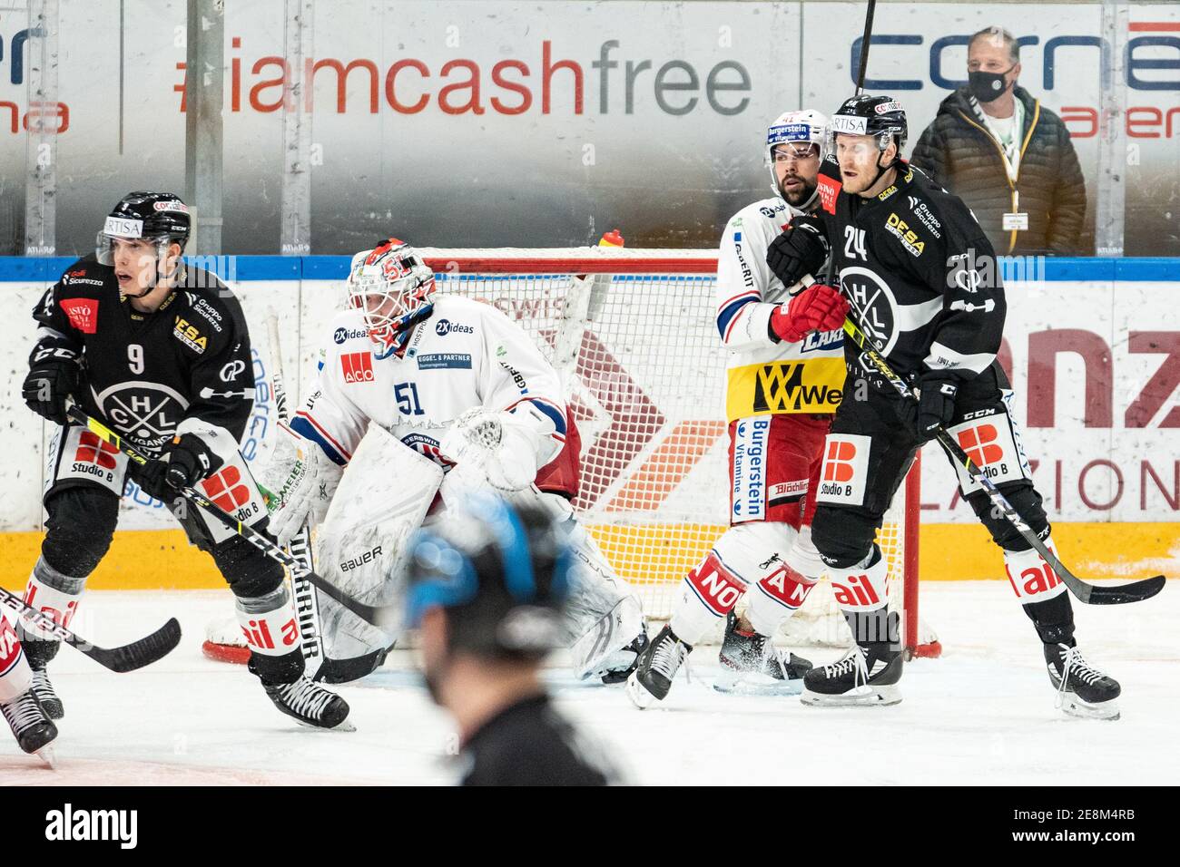 Porza, Corner Arena, National League: HC Lugano - SC, USA. 31st Jan, 2021. Rapperswil-Jona Lakers, from left to right # 9 Reto Suri (Lugano), # 51 goalkeeper Noel Bader (Lakers), # 41 Leandro Profico (Lakers), # 24 Jani Lajunen (Lugano) Credit: SPP Sport Press Photo. /Alamy Live News Stock Photo