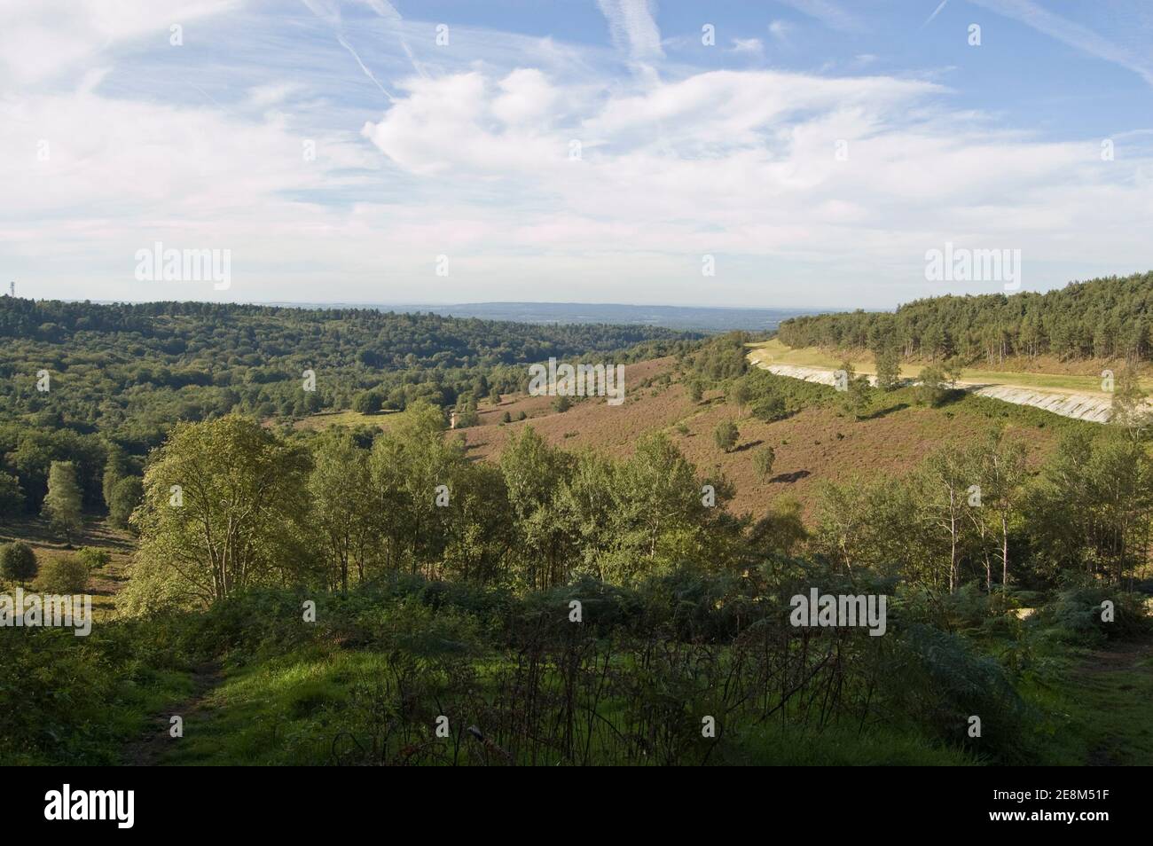 View from Hindhead Common of the deep valley known as the Devil's Punchbowl in Surrey. Traffic on the main A3 road has now been buried in a tunnel whi Stock Photo