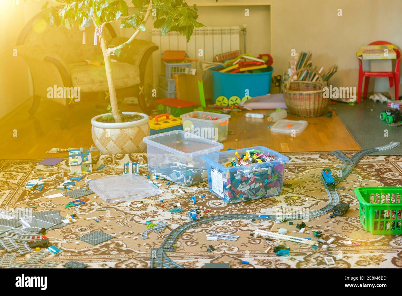 Games floor for preschoolers kindergarten. interior children's room. mess in the room. mess in the children's room, scattered toys, boxes on the floor Stock Photo