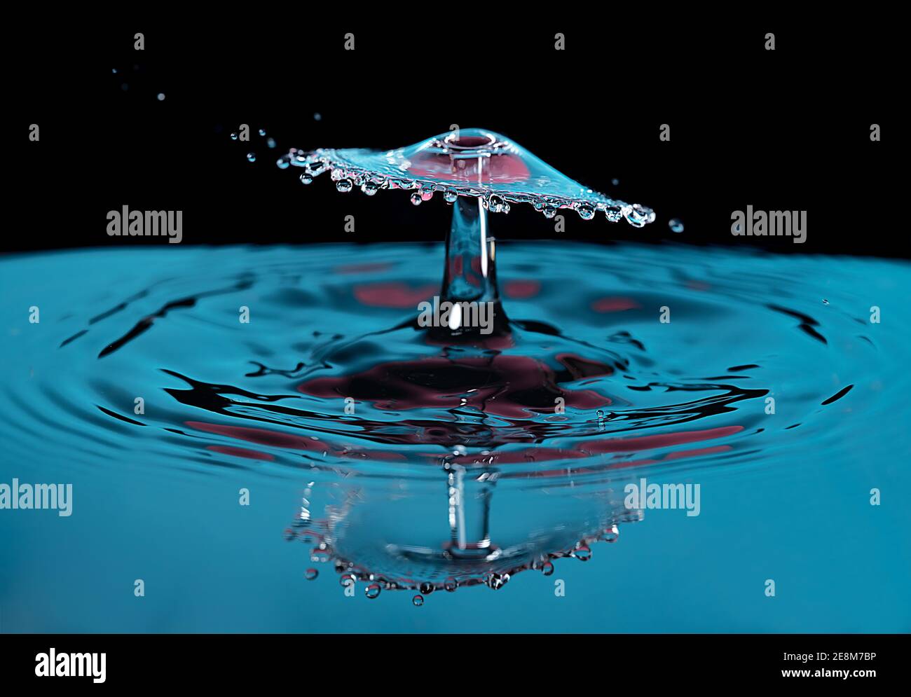 High resolution macro photograph of a colorful water drop splashing ...
