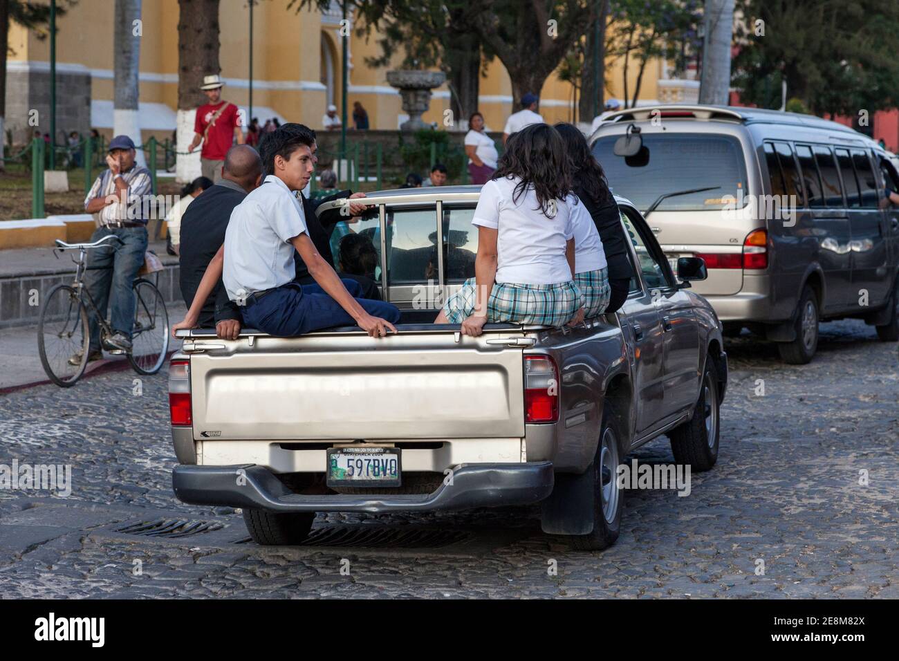 Antigua, Guatemala.  Traffic safety.  Passengers Riding in Back of Pick-up Truck, No Seat-belts. Stock Photo