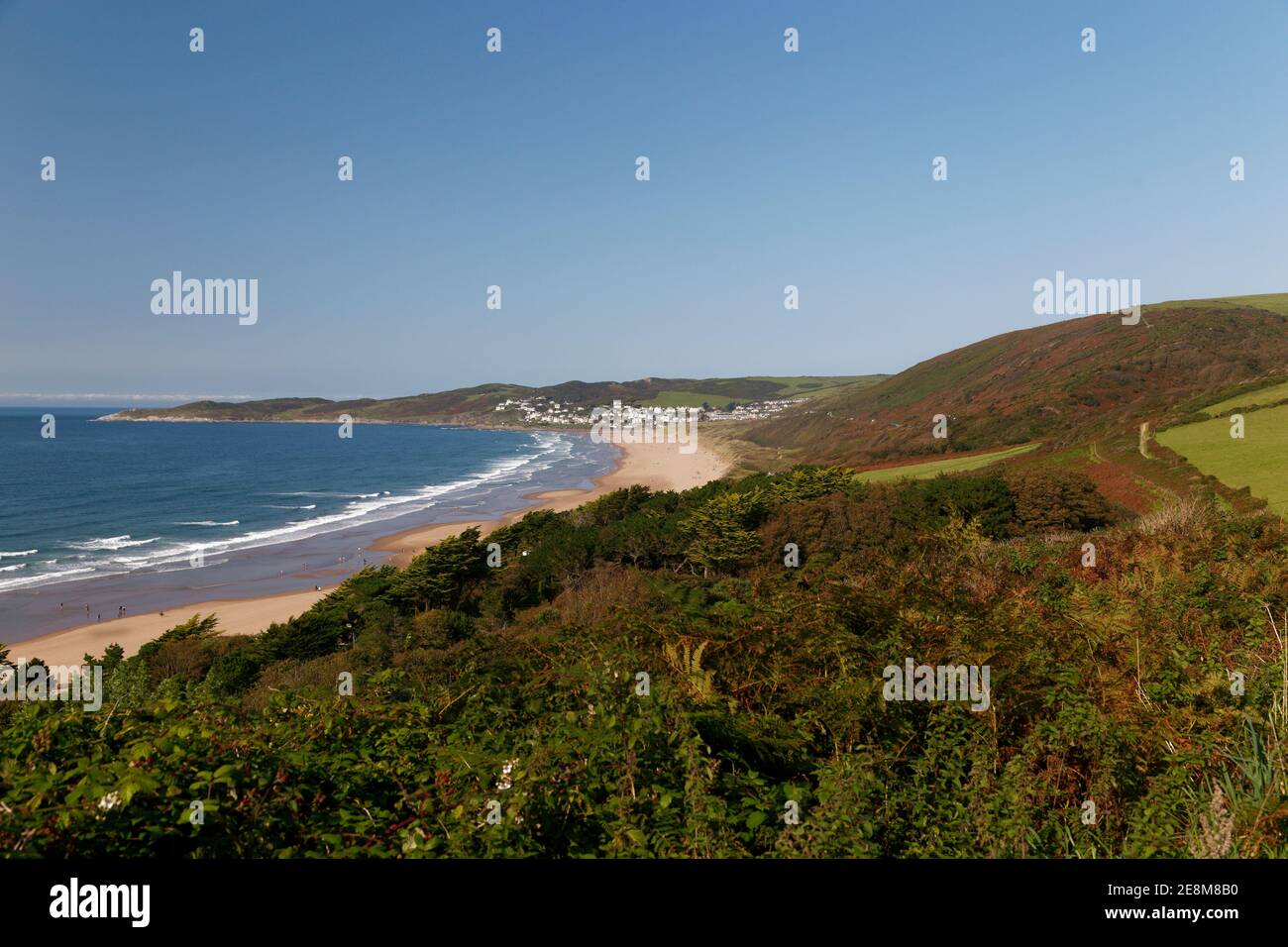 Distant view of Woolacombe beach from coastal path from Putsborough Devon Stock Photo