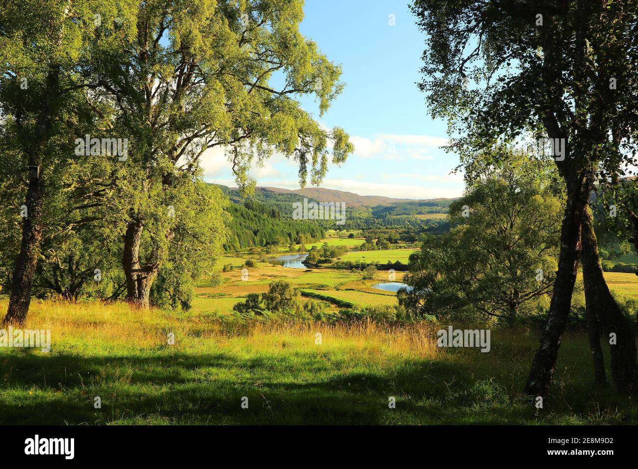 A view down from the hills of Scotland to the glens, rivers and lochs below Stock Photo