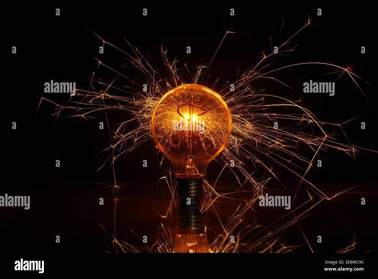 Light bulb with spark Stock Photo Alamy