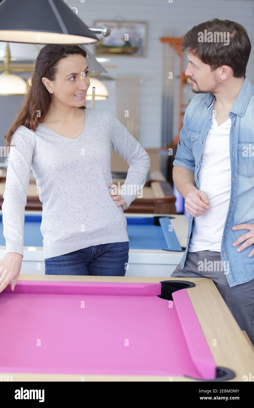 a couple is playing snooker Stock Photo