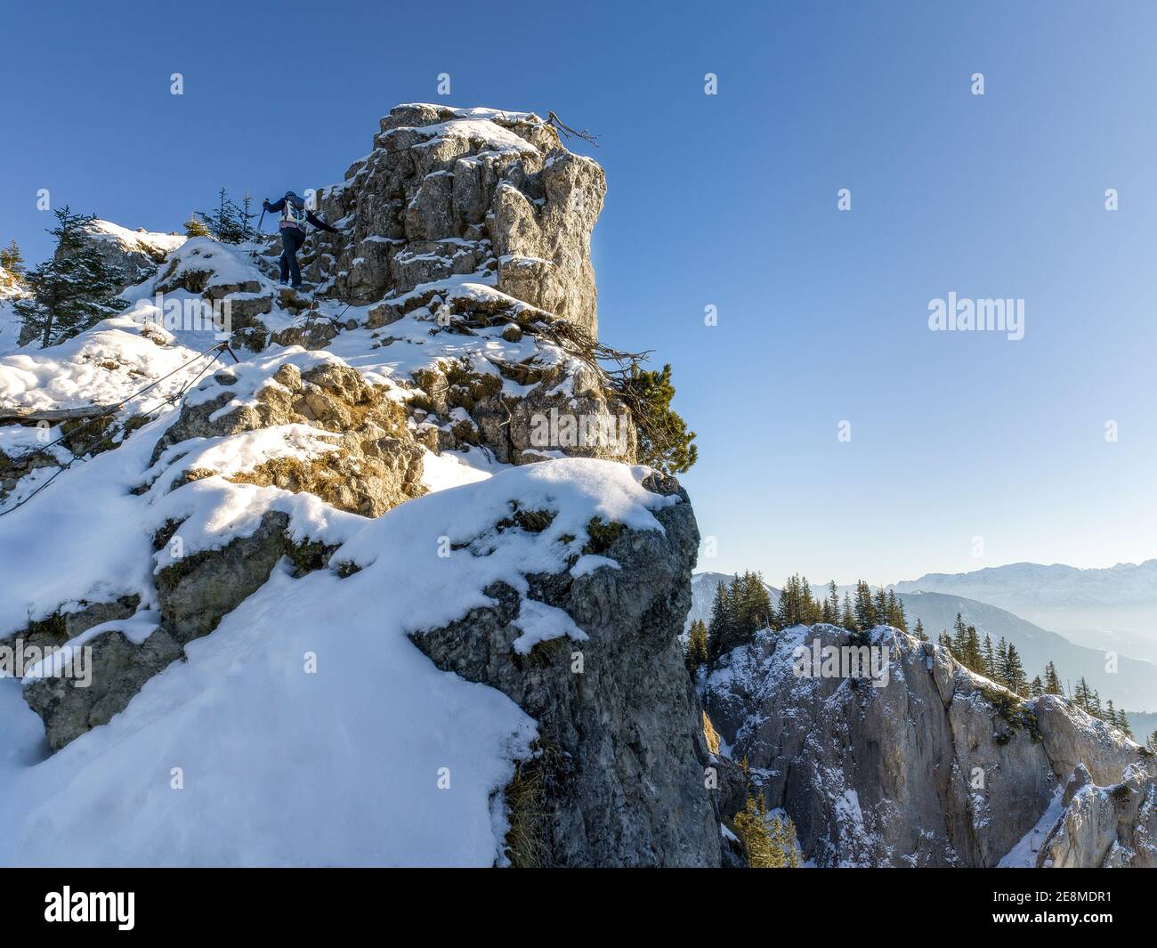 female hiker in beautiful snow covered mountains Stock Photo