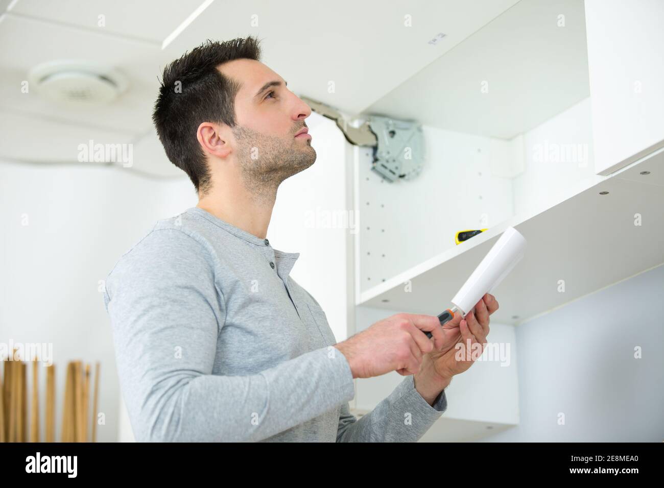 kitchen installer at carpenter work Stock Photo Alamy