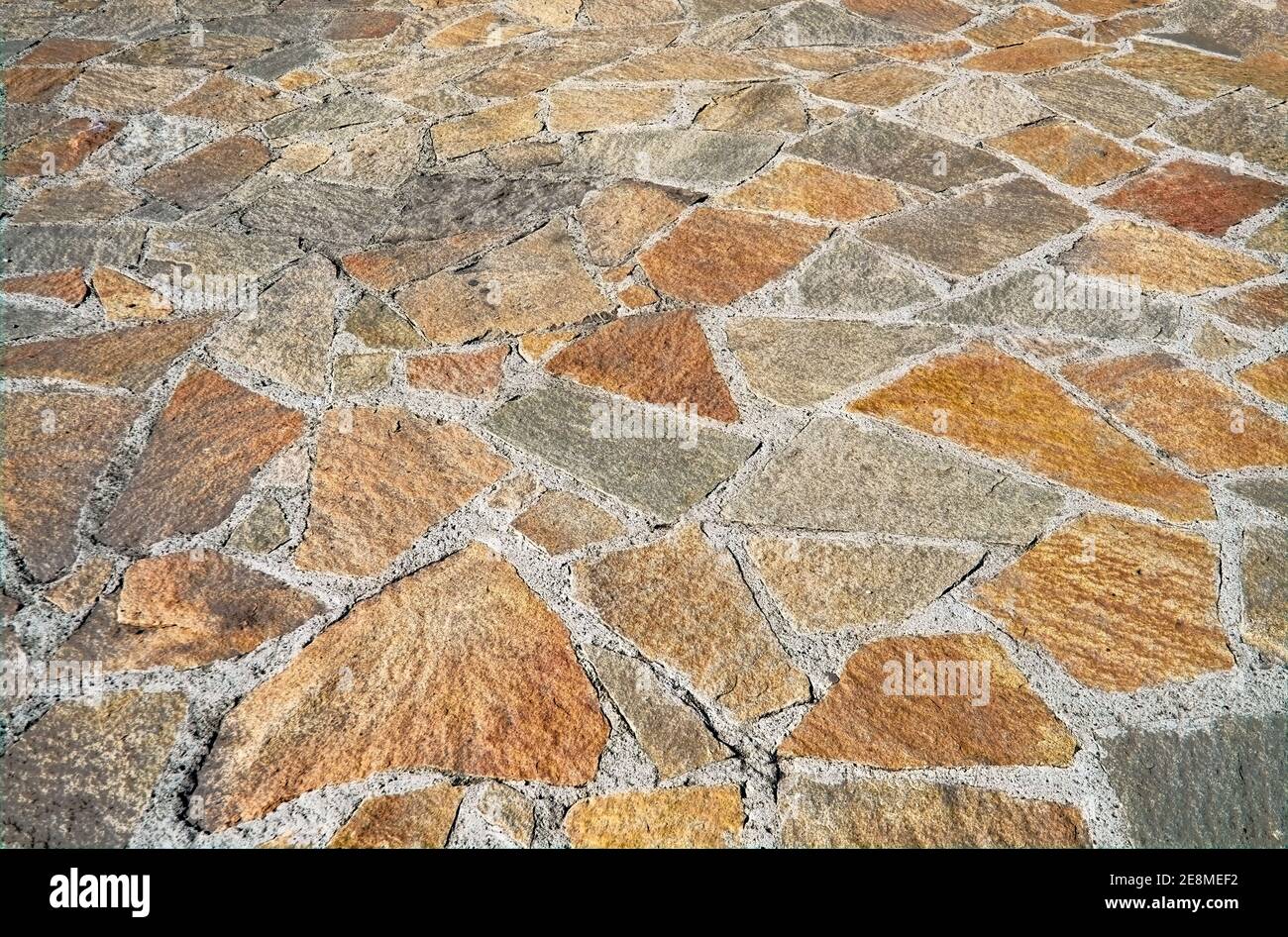 Background from paving stones, irregular natural stones. Natural yellow ...