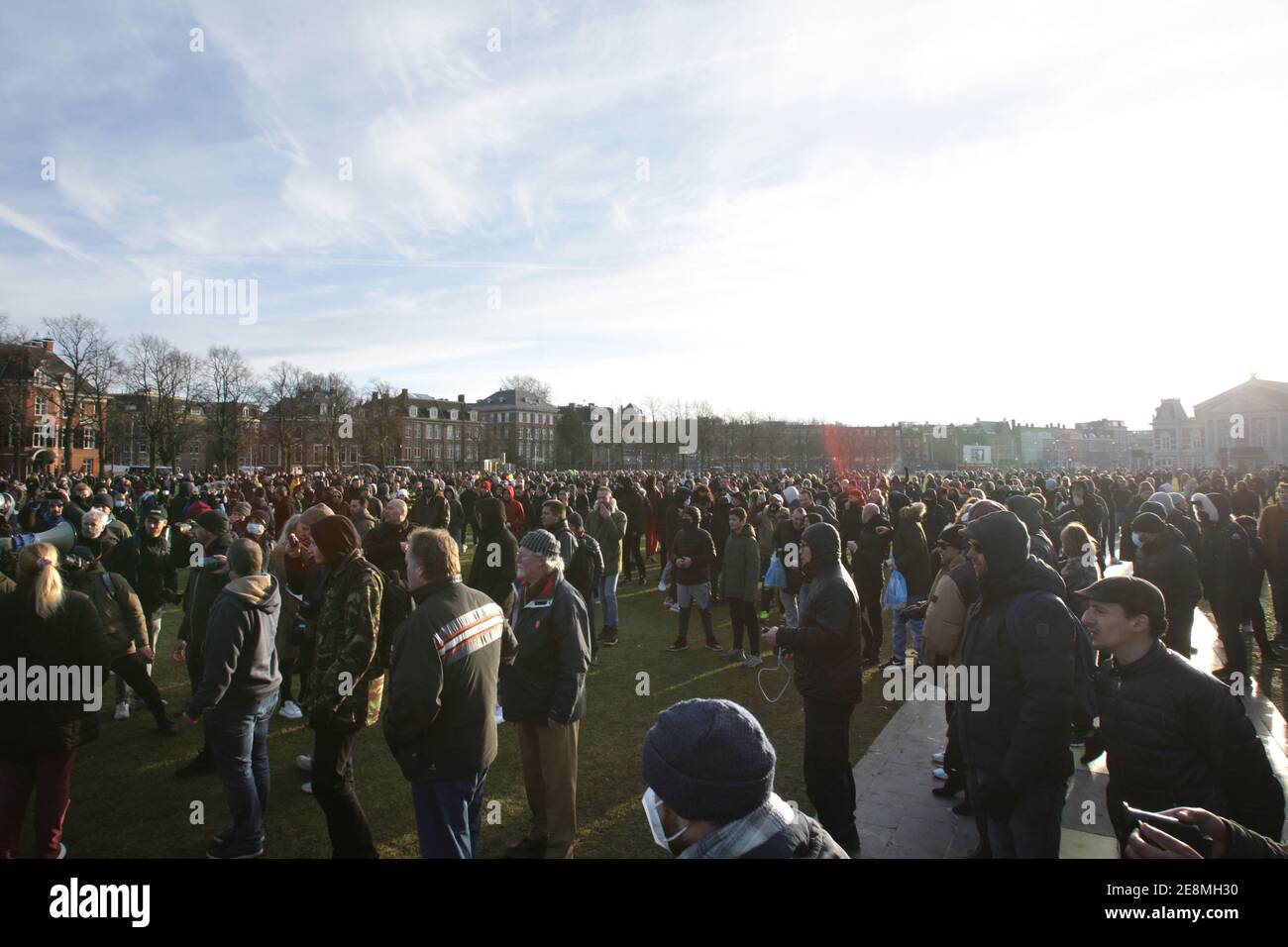 Anti-lockdown protestors gather during an illegal demonstration at the Museumplein amid the coronavirus pandemic on January 31, 2021 in Amsterdam,Neth Stock Photo