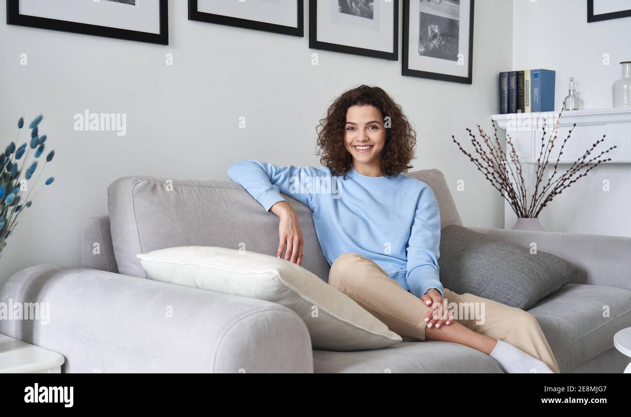 Teenage girl sitting sofa hi-res stock photography and images - Alamy