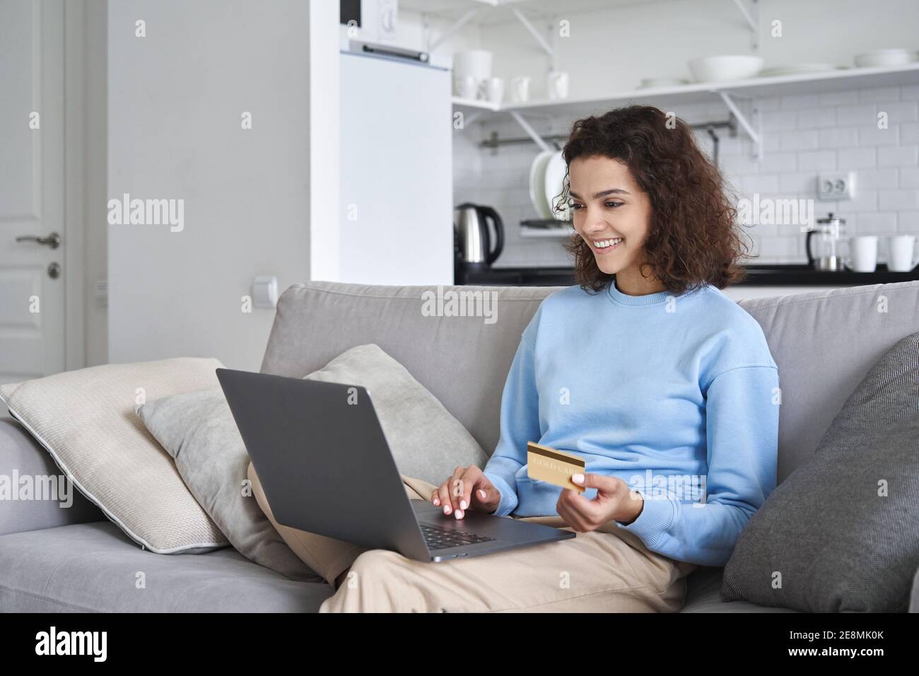 Smiling 20s Woman Making Online Purchase Holding Credit Card Using