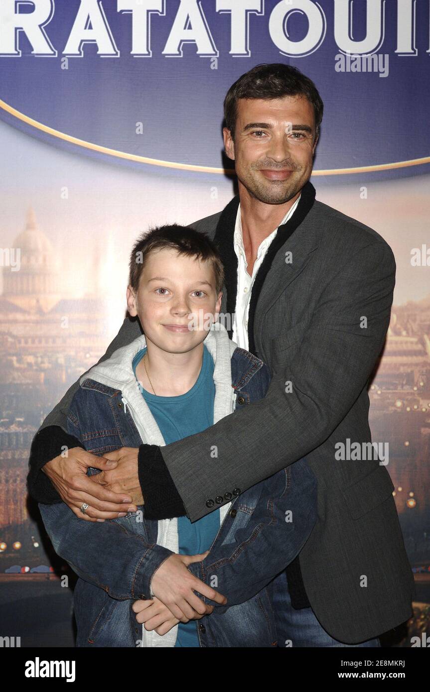 French actor Jean-Paul Michael and son attend the premiere of 'Ratatouille'  at Gaumont Marignan theater