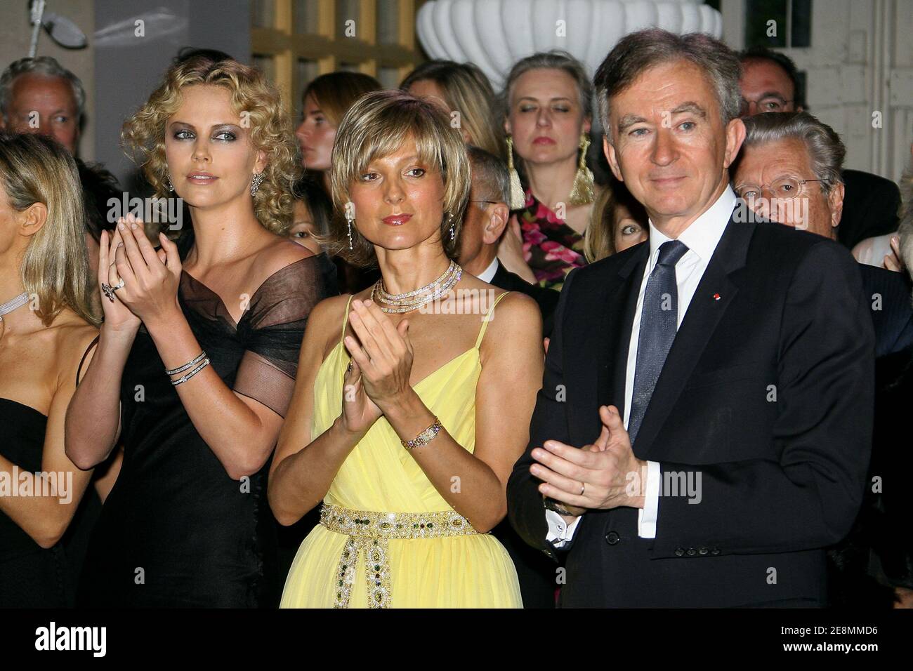 Charlize Theron and Bernard Arnault attends the Dior Womenswear