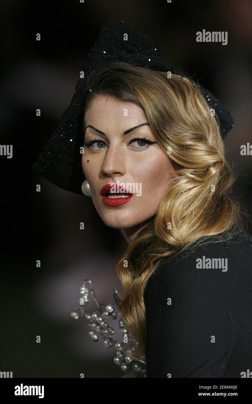 Brazilian model Gisele Bundchen presents a creation by British designer