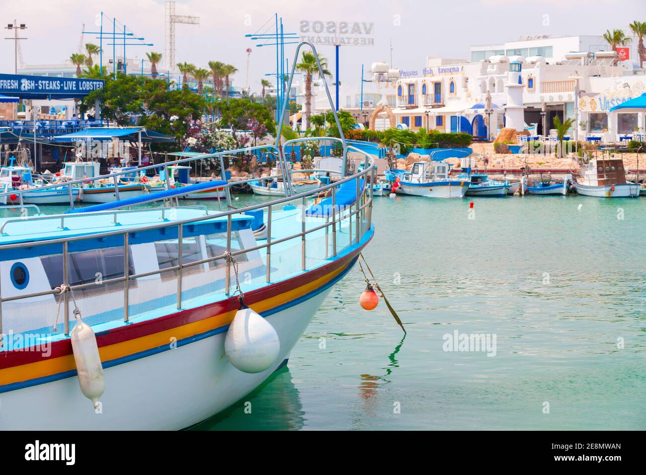 Ayia Napa, Cyprus - June 12, 2018: Agia Napa marina view, boats are moored near fish restaurant Stock Photo